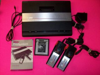 Atari 7800 Black Console (NTSC) with game Galaga Controllers Paddles 