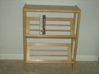 folding two tier bookcase with VHS movie included (local pickup only)