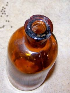 Antique round Brown bottle with M.C.W.1 on bottom