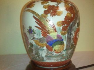 Vintage Oriental hand painted porcelain lamp   painted bird   wood 