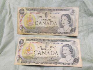 2x 1973 CANADA $1.00 ONE DOLLAR BILLS   LOW SERIAL NUMBER CIRCULATED 