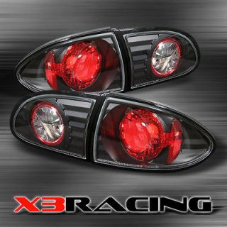 95 02 CHEVY CAVALIER BLK REAR TAIL BRAKE LIGHTS LAMPS (Fits Cavalier)