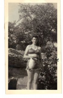 Vintage Black & White Photograph of a Woman in her Swimsuit Holding 