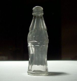 miniature coca cola bottles in Advertising