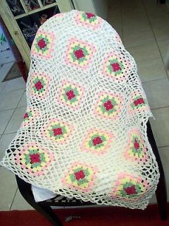 Crochet Granny Square Afghan in soft white, yellow, green, and pinks