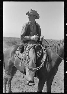 Cowboy on horse with equipment on cattle ranch near Spur,Texas