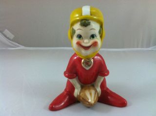 Vintage Ceramic Football Player Figurine with a Goofy Smile