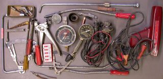 lot of vintage tune up equipment and tools for automobiles