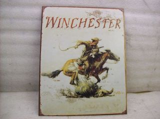Winchester cowboy on horse famous display tin litho sign.