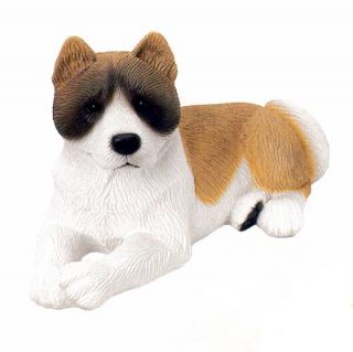 This handcrafted and exquisitely detailed Akita dog figurine 