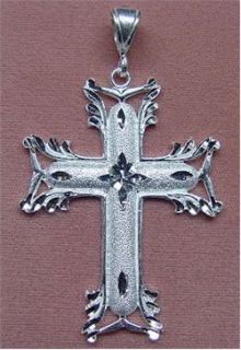 This is a Brand New Sterling Silver D/C Cross Pendant. The 
