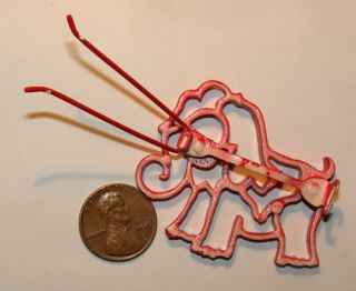 back photo is of the red elephant barrette