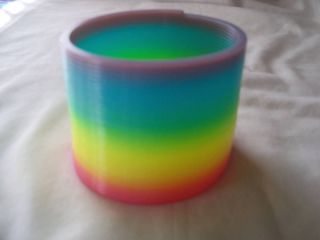 Colorful Rainbow Plastic Magic Spring Glow in the da​rk Slinky 