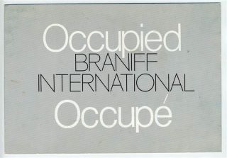 braniff international seat occupied sign occupe
