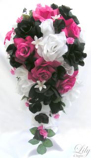 bud accented with fuchsia baby s breath and black ribbon