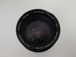 Canon T50 35mm Camera Bundle 35 200mm lens, 2 50mm Lenses, Flash