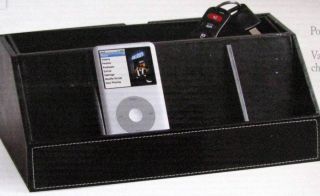   features black faux leather valet top with four charging stations