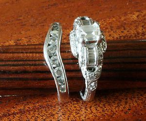Platinum engagement ring with VS1 G emerald cut center diamond