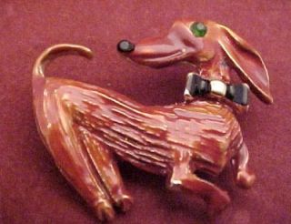  cute little figural pin with the enamel dachshund wearing a bow tie