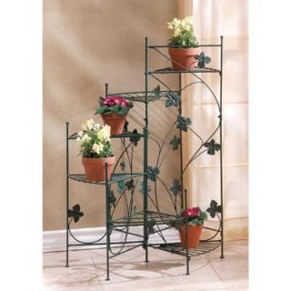 airy strands of ivy grace this staircase style plant stand six shelves