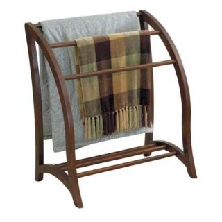 Keep spare linens within reach. Rack holds 3 quilts or bath towels