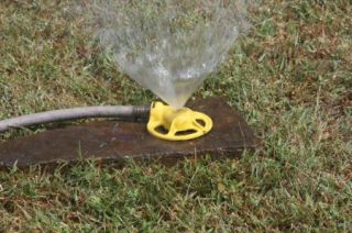 Vintage Lawn Sprinkler Pound of Rain Cast Iron Yellow