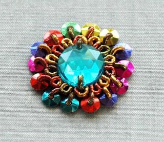  gems. Each applique patch incorporates dozens of these beads, and