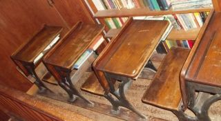 FOUR MATCHING ANTIQUE BERKLEY GRADE SCHOOL DESKS ON ORIGINAL RAILS