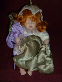 Geppeddo Fairy Laying Down Porcelain Doll