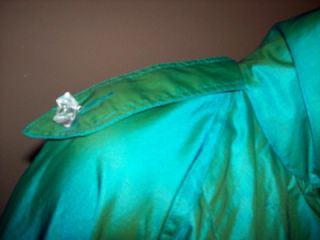 This Vintage Coat has I believe Lucite Buttons, iridescent colors are