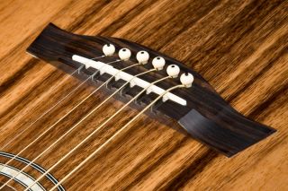 The EW50MPSENT features an Rosewood bridge and fretboard and solid