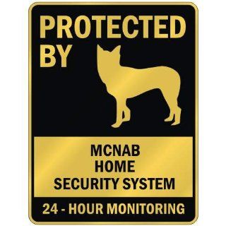 PROTECTED BY  MCNAB HOME SECURITY SYSTEM  PARKING SIGN