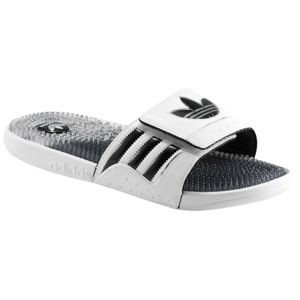 The adidas Trefoilssage slide features a hook and loop synthetic upper