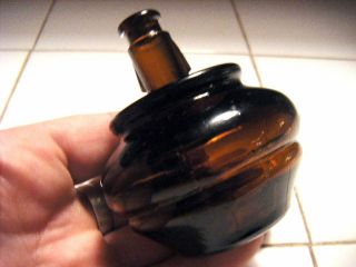 odd amber ink bottle unusual tall neck bulbous tapered body unique