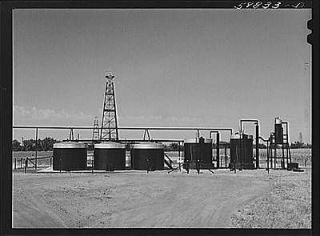 PhotoOil well derricks,oil tanks in Moundridge area near McPherson