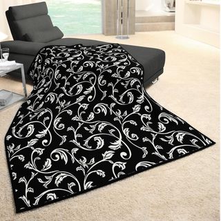 Angelohome Vine Woven Heather Black Throw (Black, ivoryMaterials 86 percent acrylic/ 7 percent cotton/ 7 percent polyesterCare instructions Machine wash, tumble dry Dimensions 55 inches wide x 70 inches long 100 percent made in GermanyThe digital imag