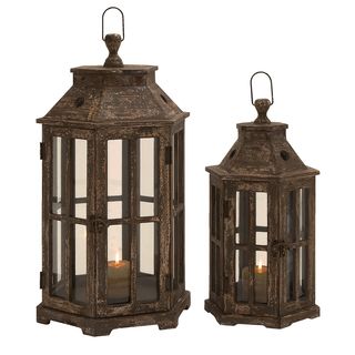 San Francisco Weathered Wood Hexagonal Lantern Set of 2 (BrownCare Wipe with a soft dry clothVented topsHandles for transportingLanterns have hinged doorsEach holds candlesticks or pillar candles (not included)Dimensions 24.5 inches high x 12 inches wid